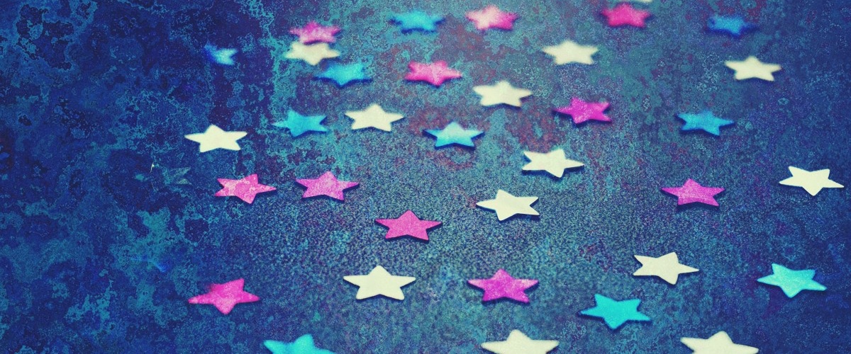selective focus photography of multicolored confetti lot